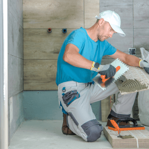 Tile Installer Remodeling the Bathroom for water damage restoration process