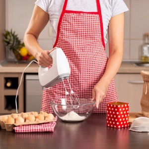 Woman using a kitchen mixer