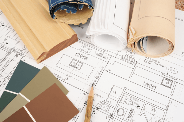 home renovation blueprint, color samples, and cabinet molding